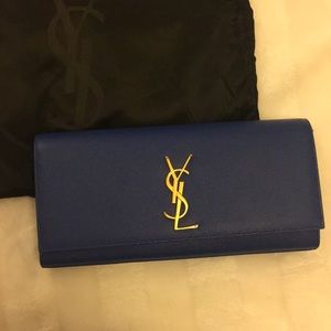 Authentic YSL clutch (never used)